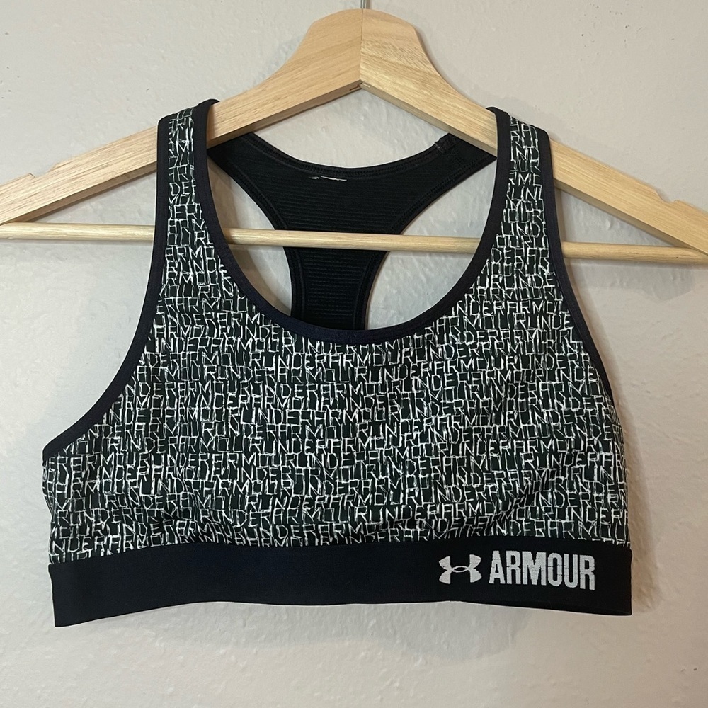 Under Armour girls XS sports bra. Black&white wording, racer back,good condition